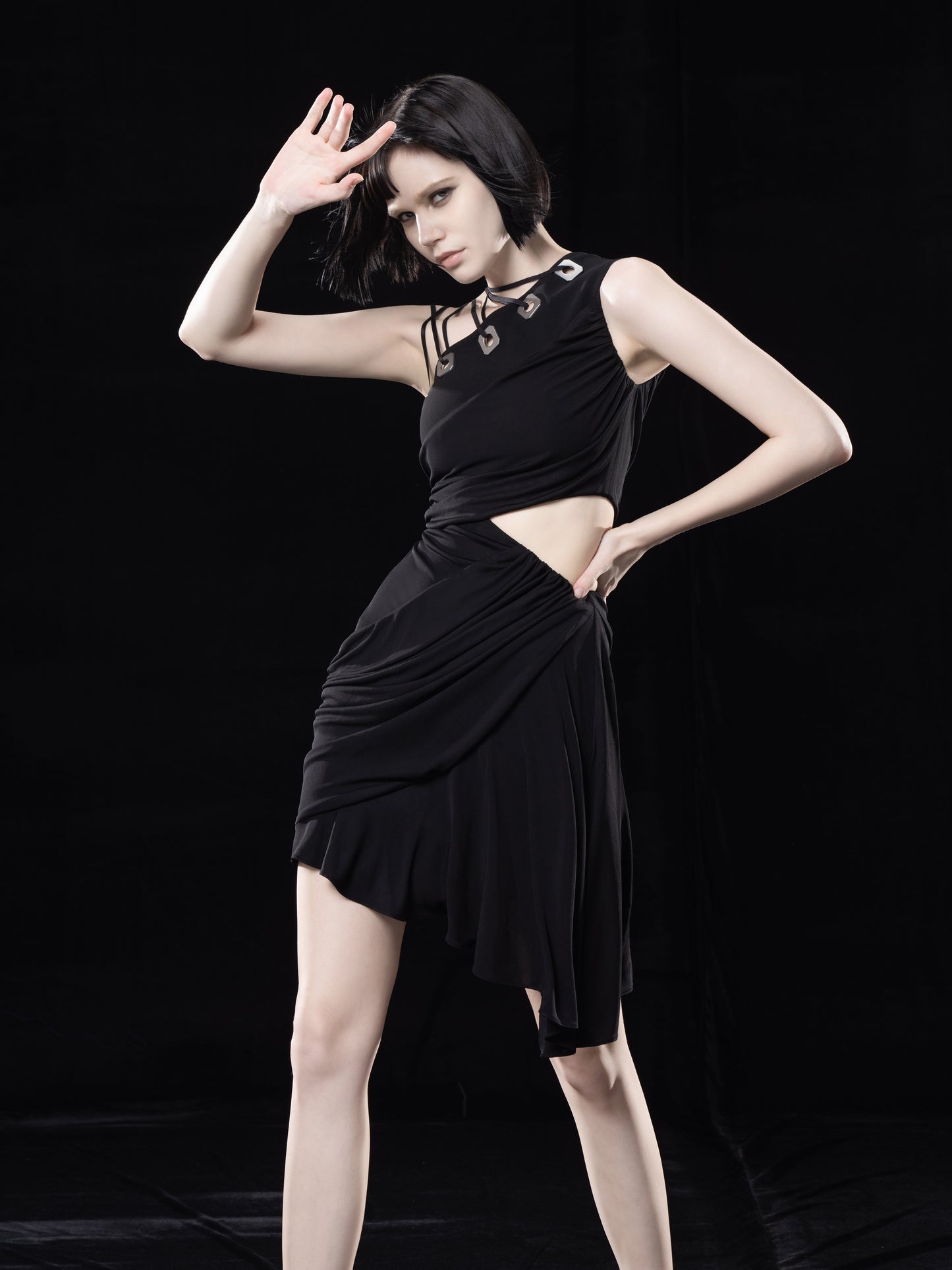 BLACK DRAPED DRESS WITH CUT-OUTS. ANND TIED DETAIL